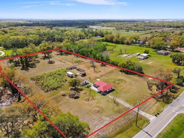 birds eye view of property featuring a rural view