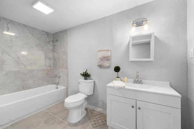 bathroom featuring tile patterned floors, shower / bath combination, toilet, and vanity