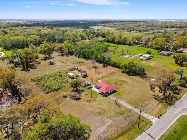 birds eye view of property with a rural view