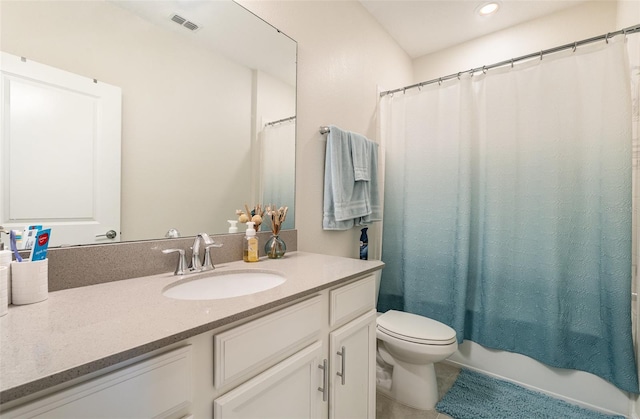 bathroom with vanity, toilet, and shower / tub combo with curtain