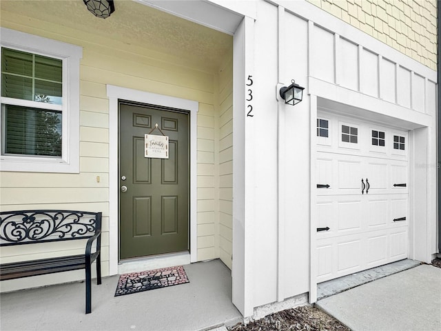 property entrance with board and batten siding