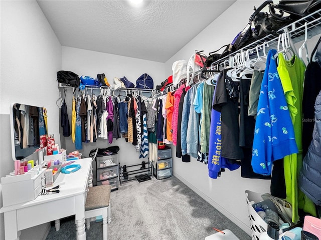 spacious closet with carpet floors