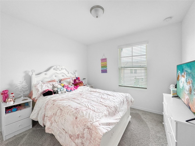 carpeted bedroom with baseboards