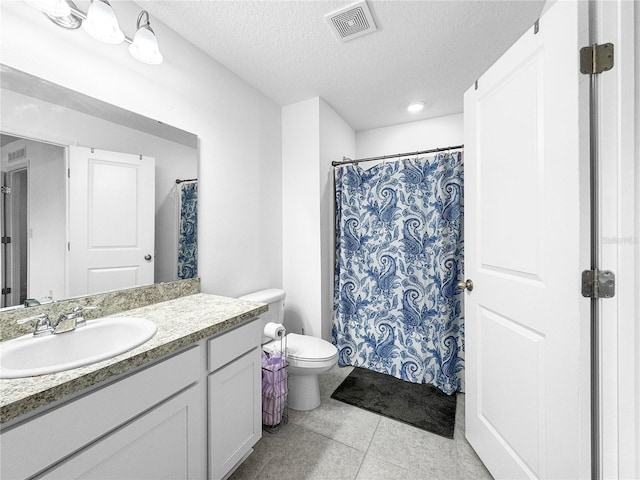 bathroom with visible vents, toilet, tile patterned floors, a textured ceiling, and vanity