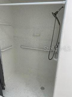 full bathroom featuring a shower stall