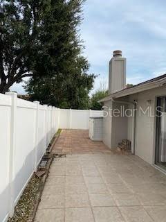 view of patio / terrace featuring fence