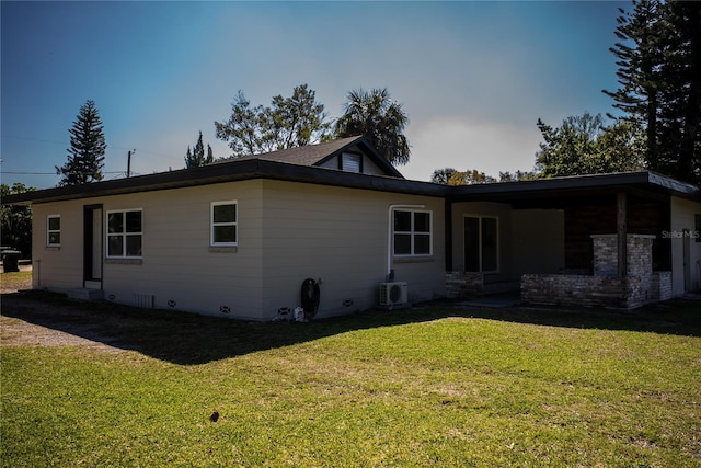 view of property exterior featuring ac unit, crawl space, and a lawn