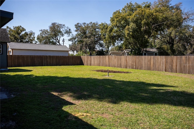 view of yard with a fenced backyard