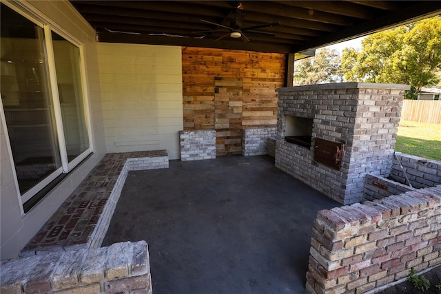 view of patio / terrace featuring ceiling fan and fence