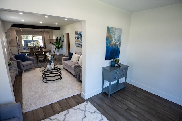 living area featuring ornamental molding, dark wood-style flooring, recessed lighting, and baseboards