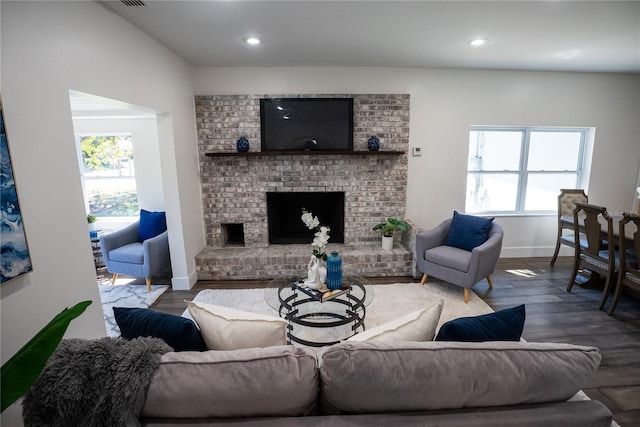 living area featuring a fireplace, recessed lighting, visible vents, wood finished floors, and baseboards