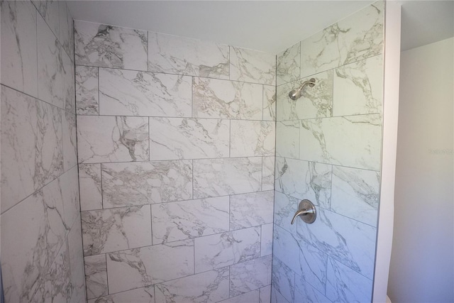 full bath featuring tiled shower