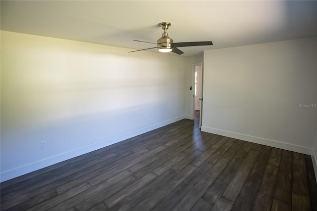 unfurnished room featuring a ceiling fan, baseboards, and dark wood-type flooring