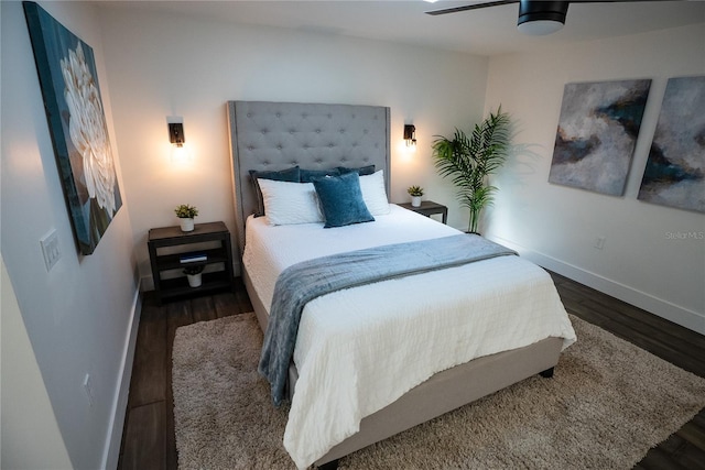 bedroom with baseboards and wood finished floors