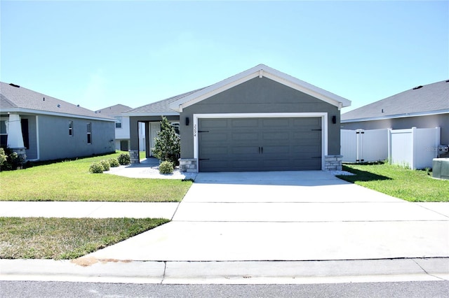 ranch-style home with driveway, stucco siding, an attached garage, fence, and a front yard