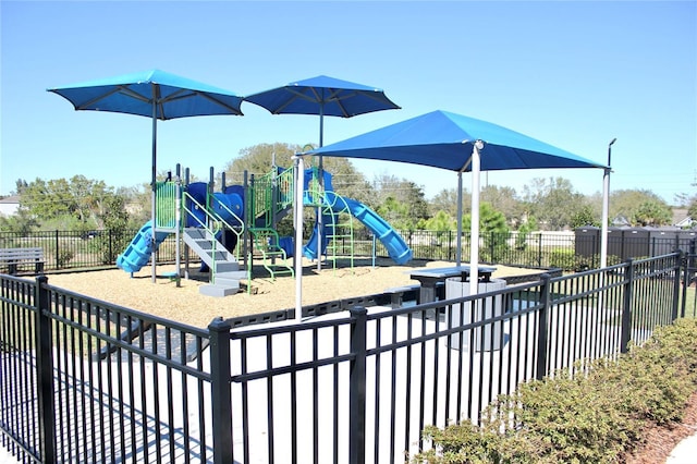 community jungle gym featuring fence