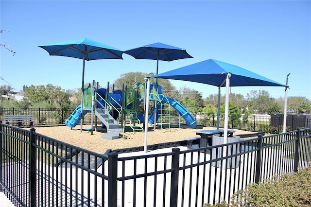 community jungle gym featuring fence