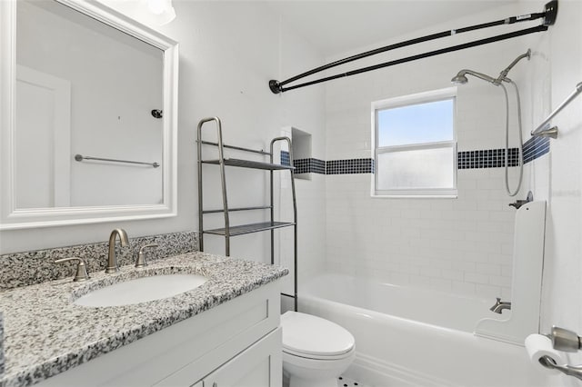 bathroom with shower / bathtub combination, vanity, and toilet