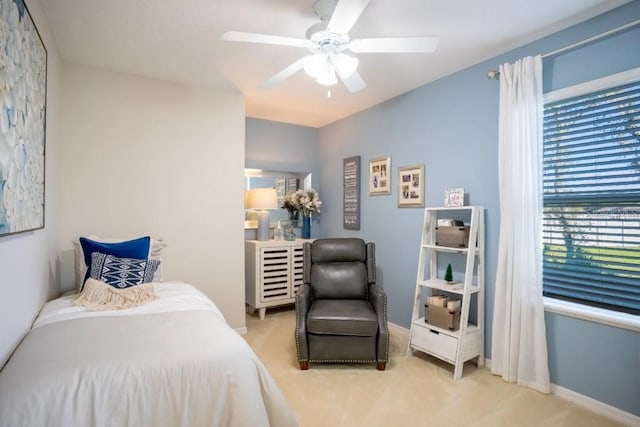 bedroom with ceiling fan, carpet flooring, and baseboards