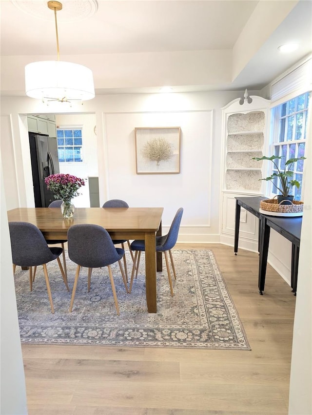 dining area with light wood-style flooring