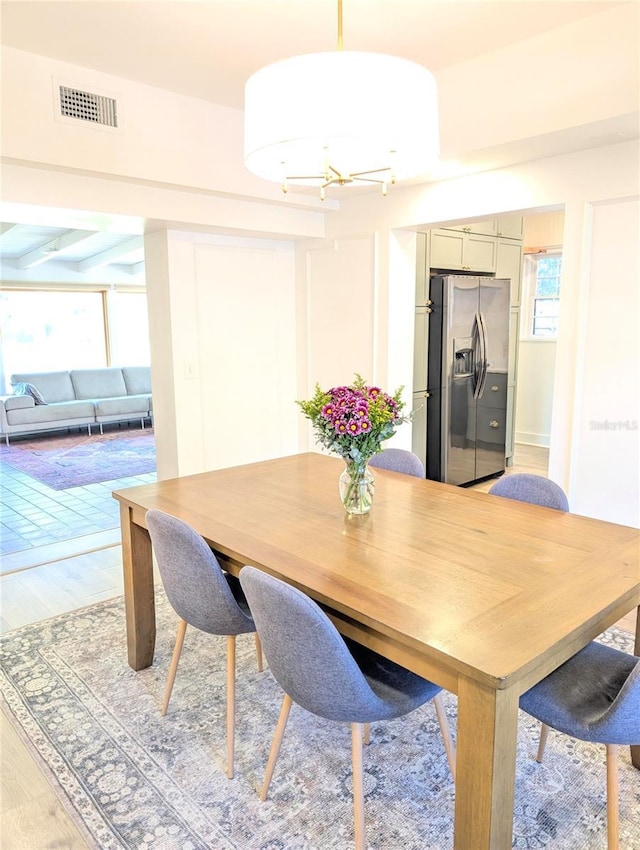 dining room with visible vents and light wood-style floors