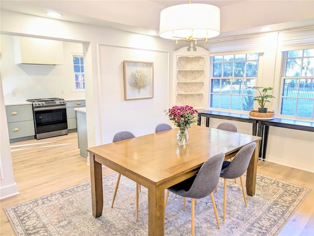 dining space with light wood-style flooring