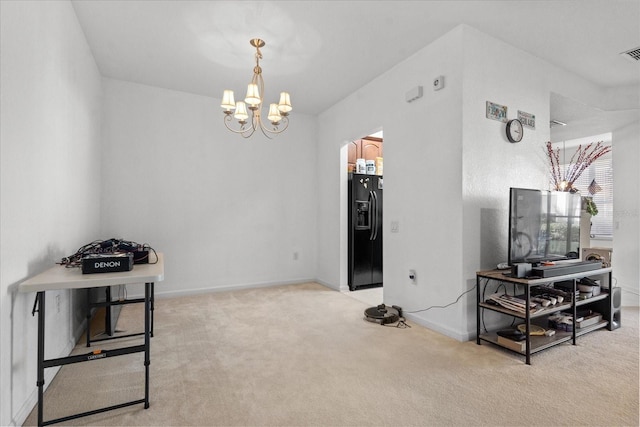 interior space featuring baseboards, visible vents, and an inviting chandelier