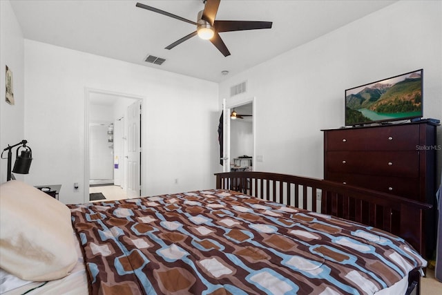 bedroom featuring a ceiling fan, visible vents, and carpet flooring