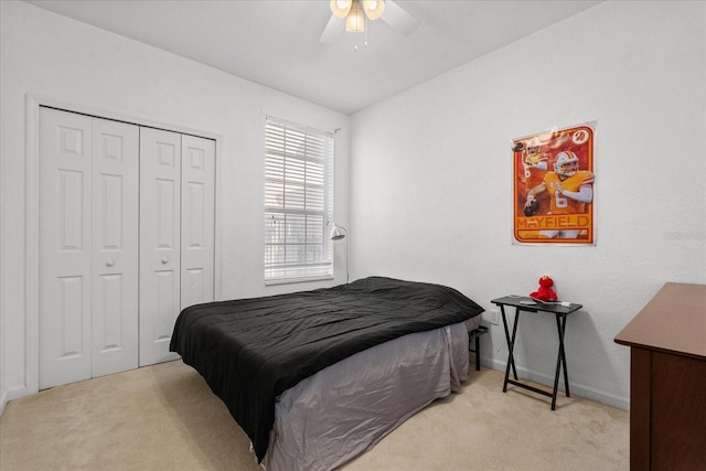 bedroom featuring a closet, carpet flooring, a ceiling fan, and baseboards