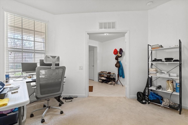 carpeted office with baseboards and visible vents