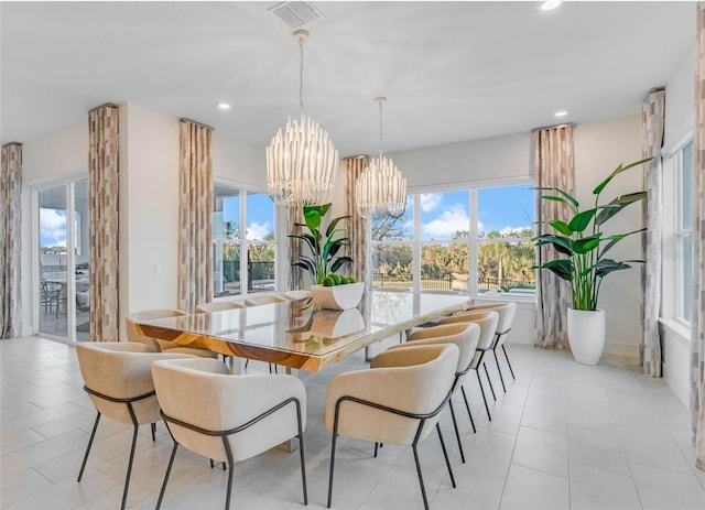 dining space with a chandelier, plenty of natural light, visible vents, and recessed lighting