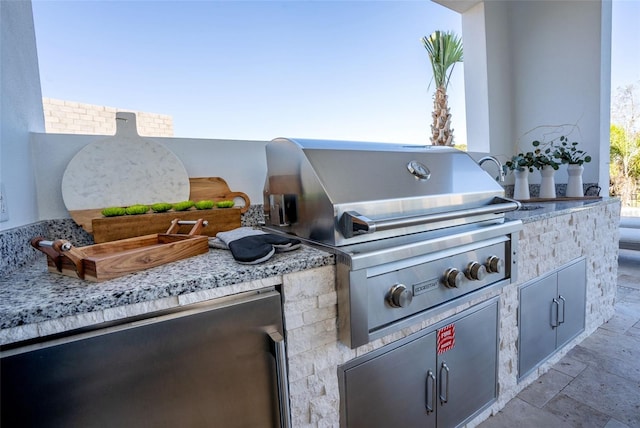 view of patio with exterior kitchen and area for grilling