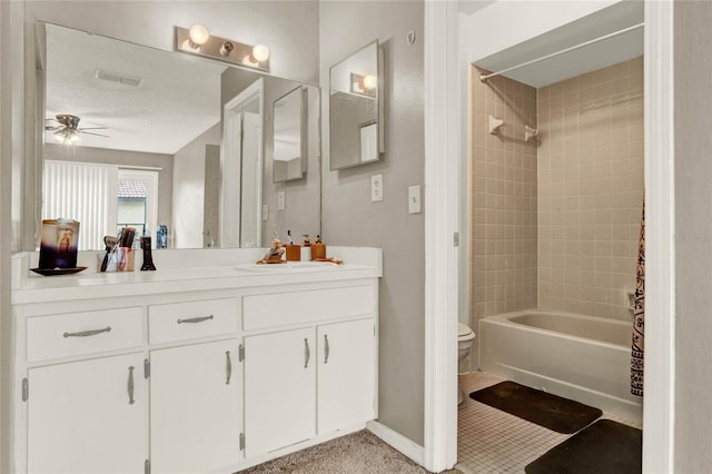 full bathroom with ceiling fan, toilet, visible vents, vanity, and shower / bathtub combination with curtain