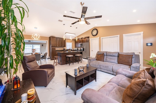 living area with a ceiling fan, marble finish floor, visible vents, and vaulted ceiling