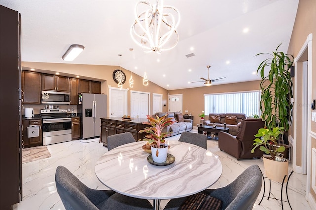 dining room with lofted ceiling, marble finish floor, visible vents, and ceiling fan with notable chandelier