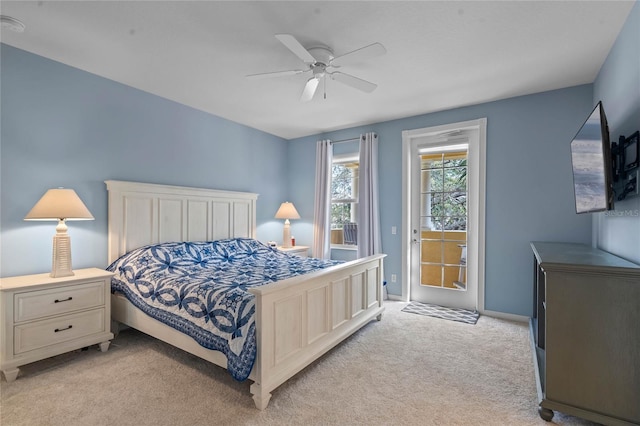 bedroom with access to outside, a ceiling fan, and light colored carpet