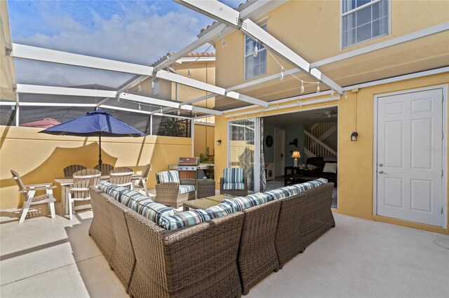 view of patio / terrace featuring glass enclosure and outdoor lounge area