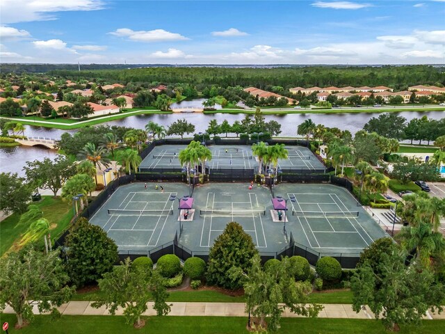 birds eye view of property with a water view