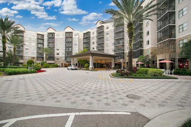 view of property featuring uncovered parking