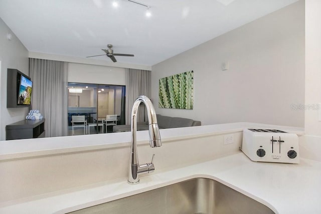 details with ceiling fan and a sink