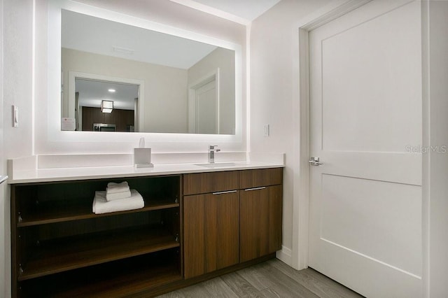 bathroom featuring vanity and wood finished floors