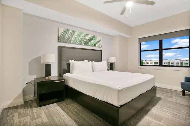 bedroom featuring a ceiling fan and baseboards