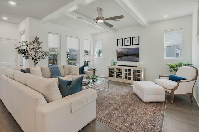 living area with recessed lighting, beamed ceiling, and wood finished floors