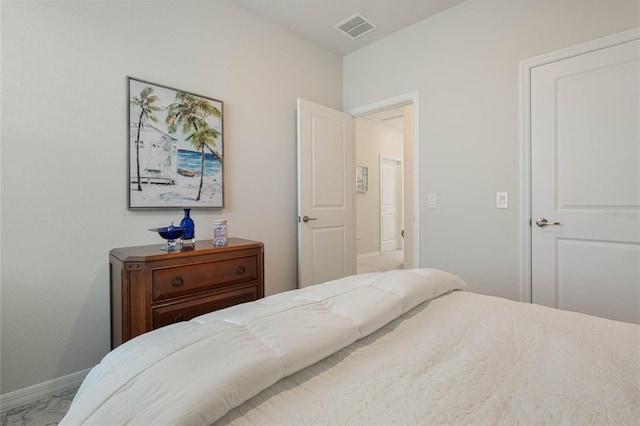 bedroom with visible vents and baseboards