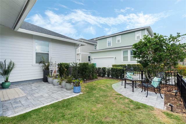 view of yard featuring fence and a patio