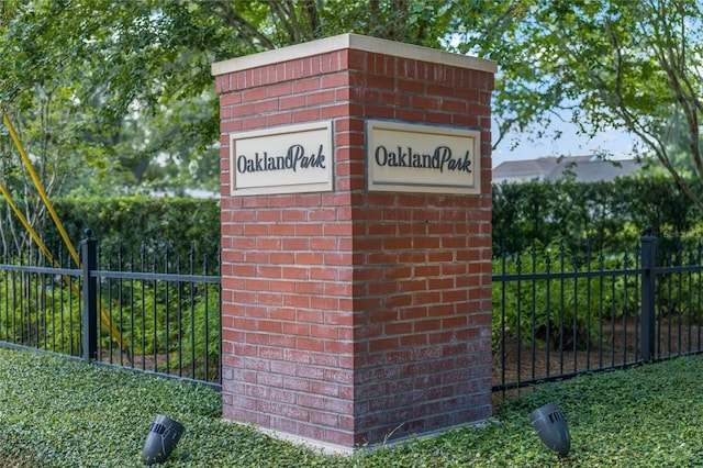 community sign featuring fence