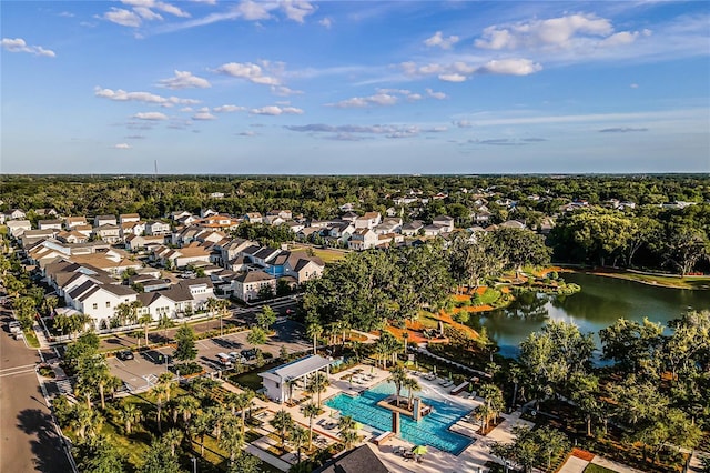 drone / aerial view with a water view and a residential view