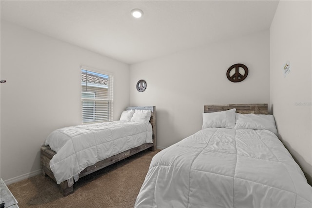 carpeted bedroom with baseboards