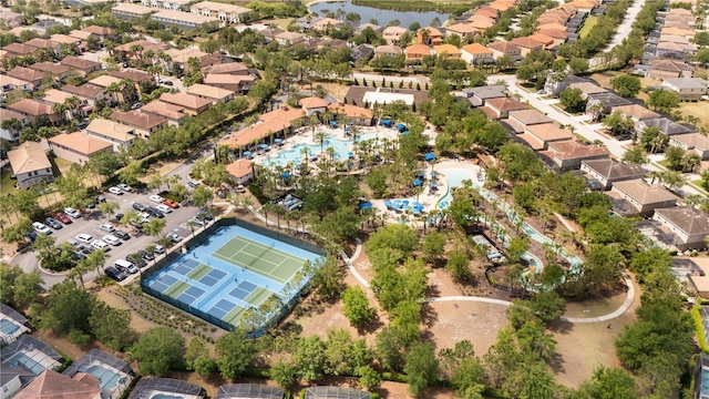 bird's eye view with a water view and a residential view