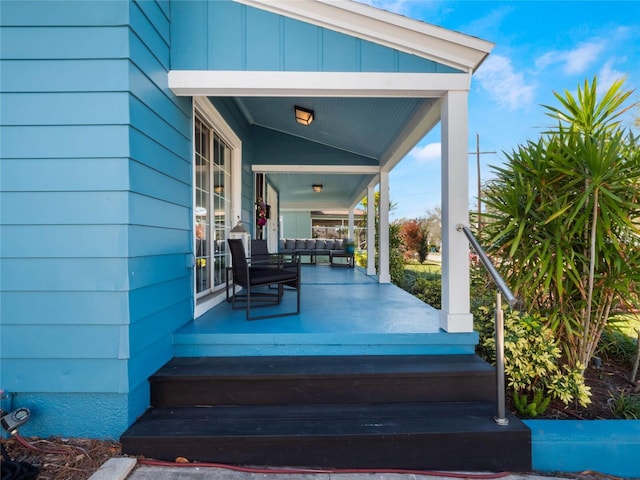 wooden terrace featuring covered porch